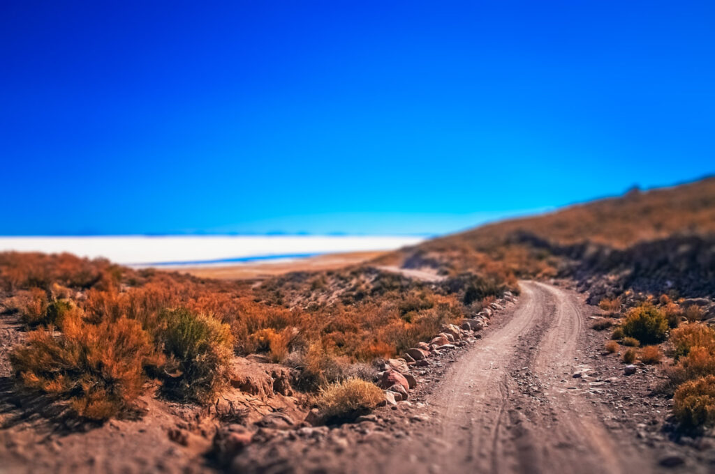 Remote road leading to the biggest of salt lakes, Salar de Uyuni in Bolivia