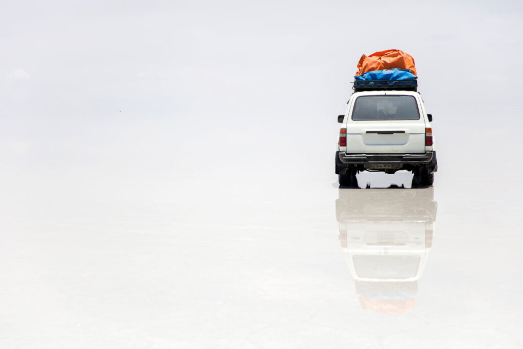 Terrain vehicle at Salar de uyuni salt flat in Bolivia